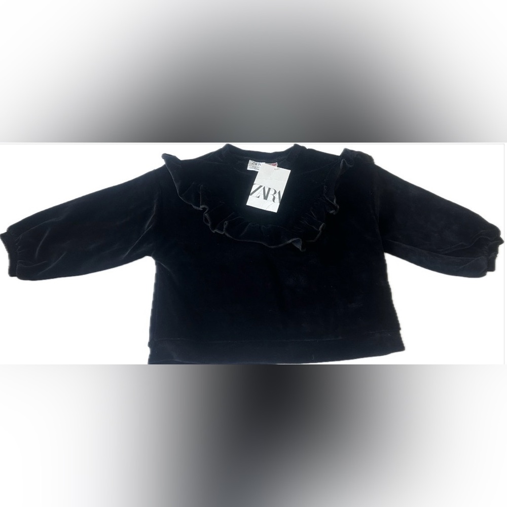 Zara girls' black velvet sweater featuring a ruffled collar.  Size 3-4T.